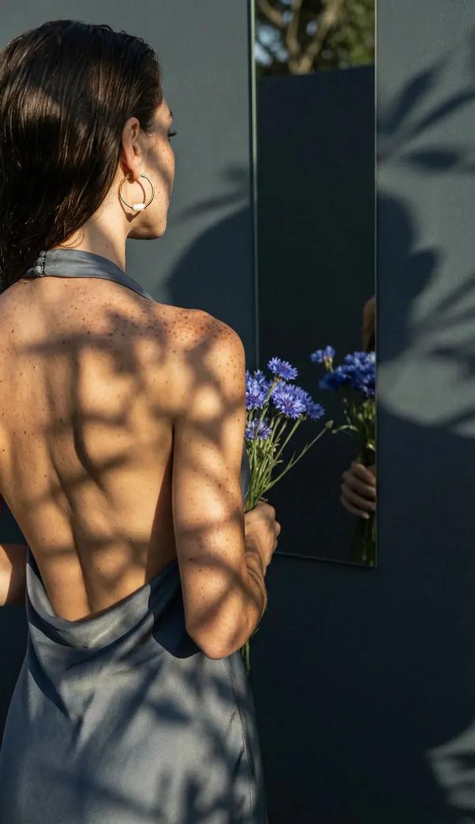 A professional, high-end photograph emphasizing the physical interplay of light and shadow on re