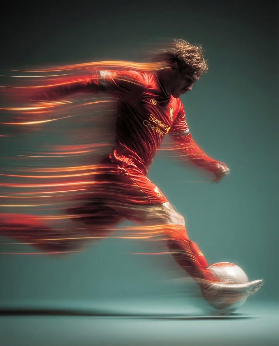 Panning shot of a mysterious soccer player in red proffesional soccer jearsy mid air kicking a b 2