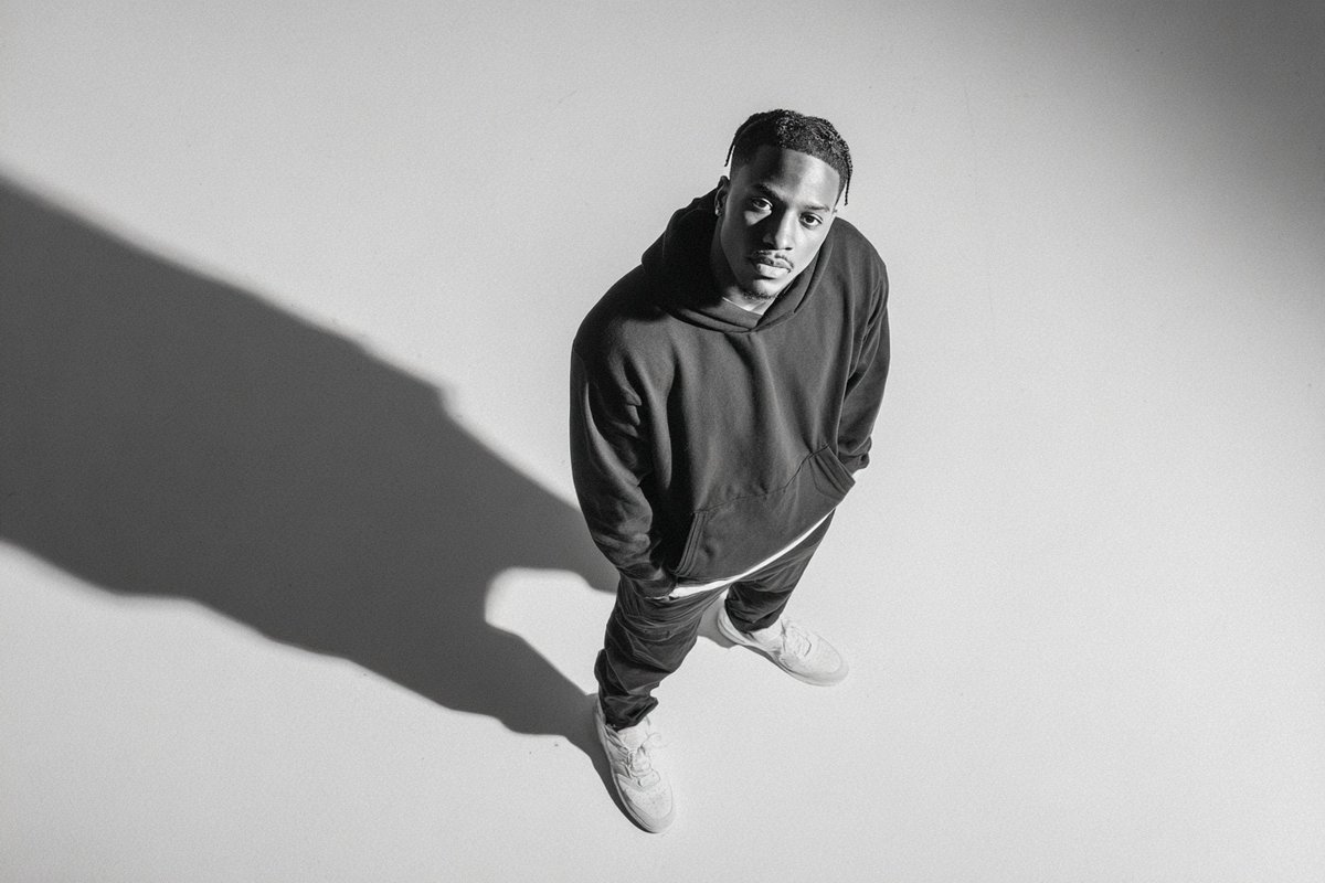A [subject] photographed from a 35-degree overhead angle, standing alone in an off-white studio 