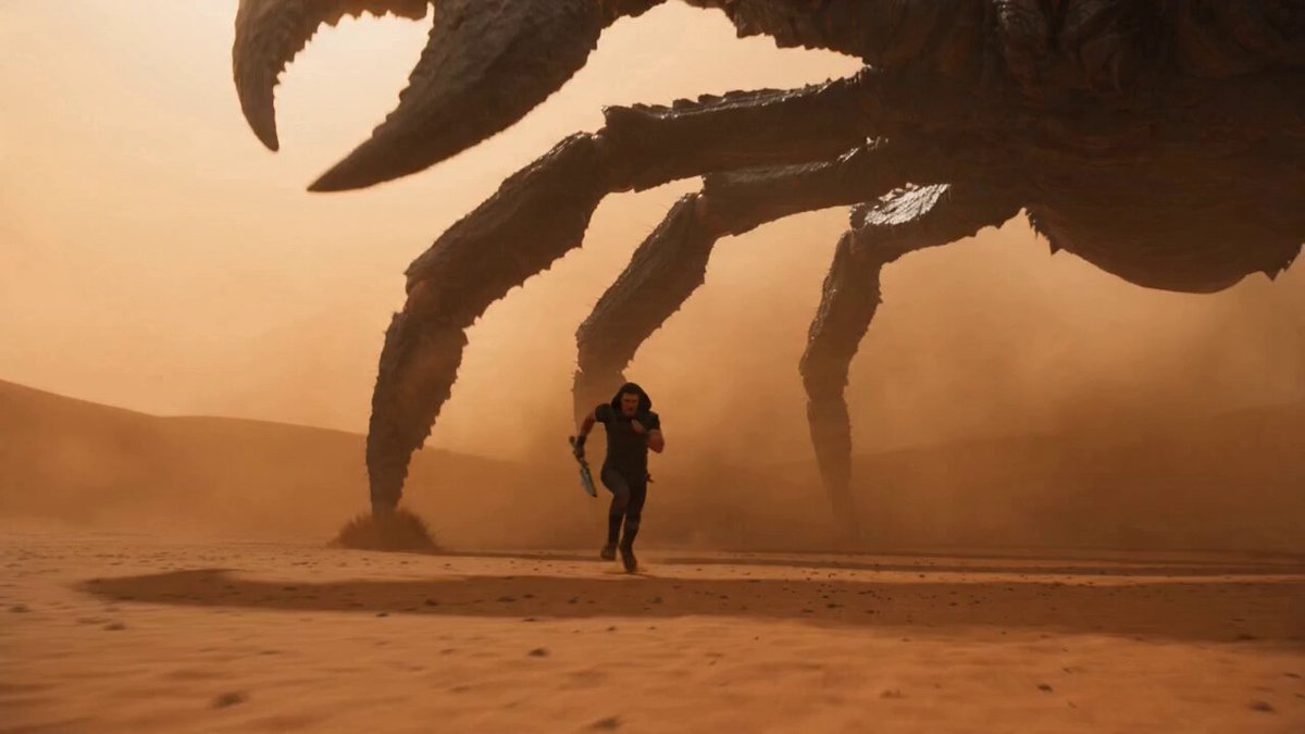 n intensely realistic, VFX-heavy cinematic sequence shot on ARRI Alexa 65. In a vast, heat-shimm
