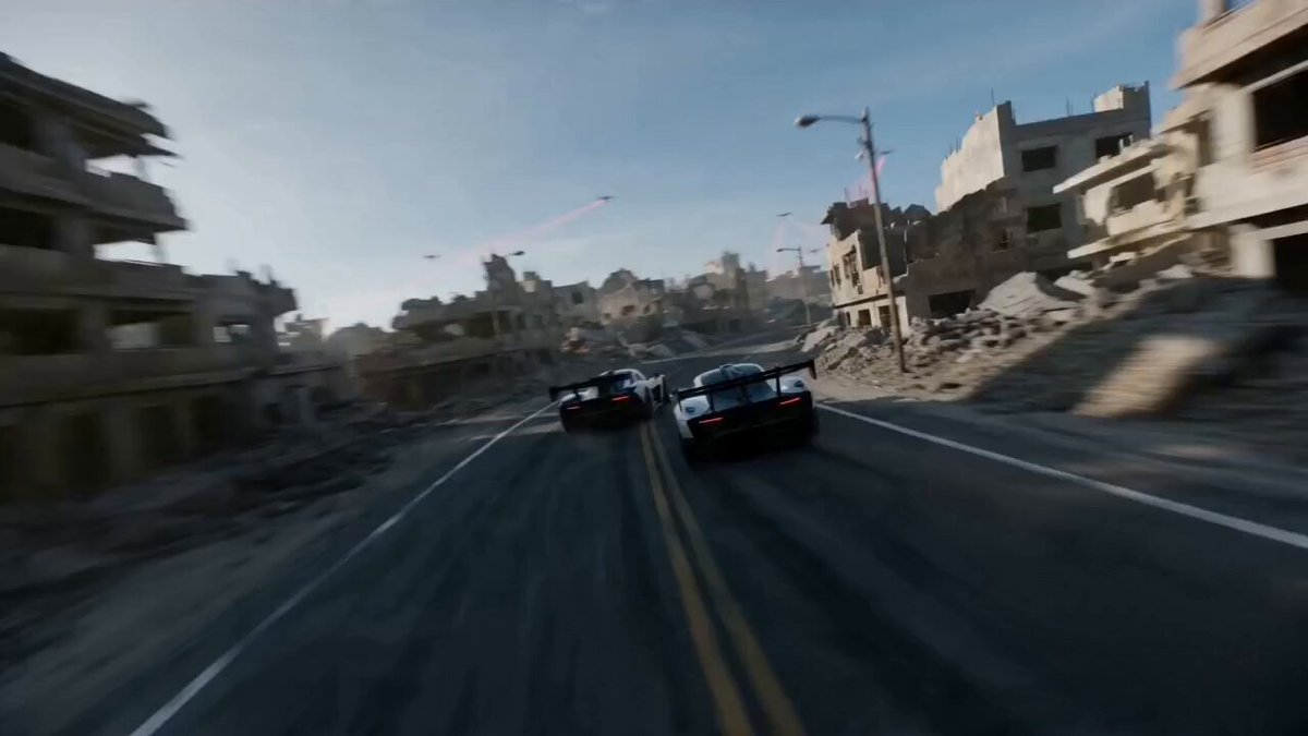 FPV drone camera chasing a pack of 2 racing cars speeding together on a super narrow curvy road 