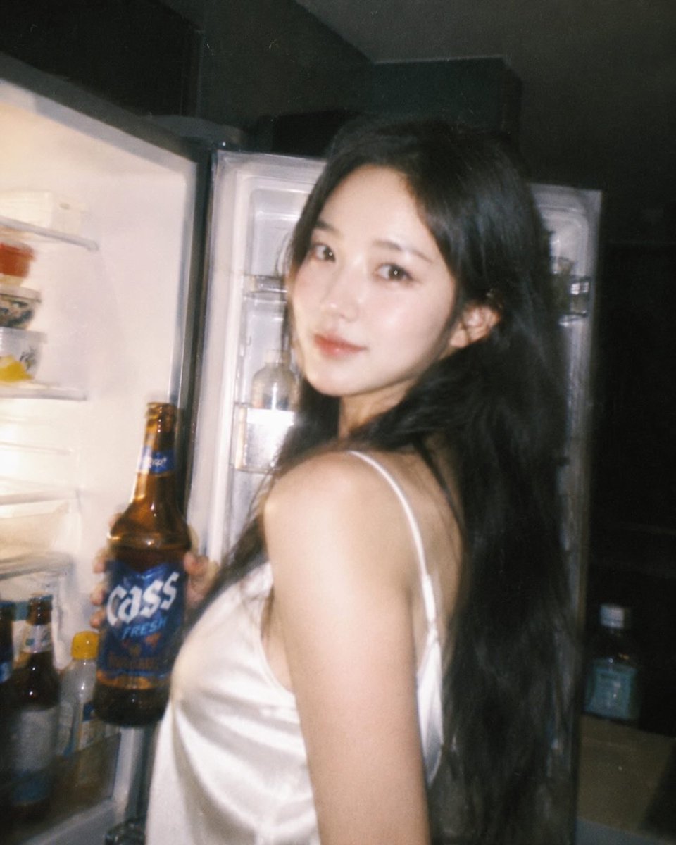 Ultra-realistic candid night photography of a beautiful East Asian woman with long black hair we 2