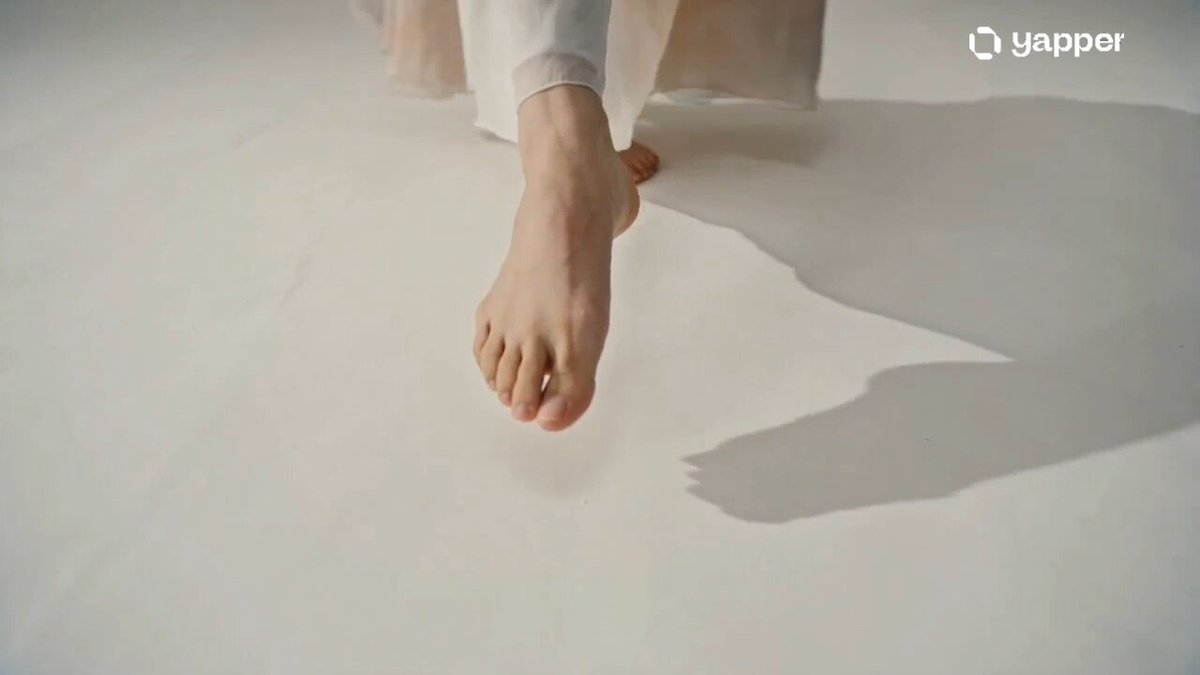 Create a 15-second cinematic video in an ink wash + watercolor painting style. A graceful dancer