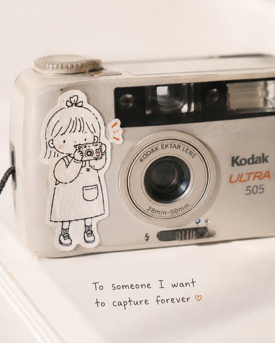 Ultra-realistic close-up product photography of a vintage silver compact Kodak point-and-shoot c 2
